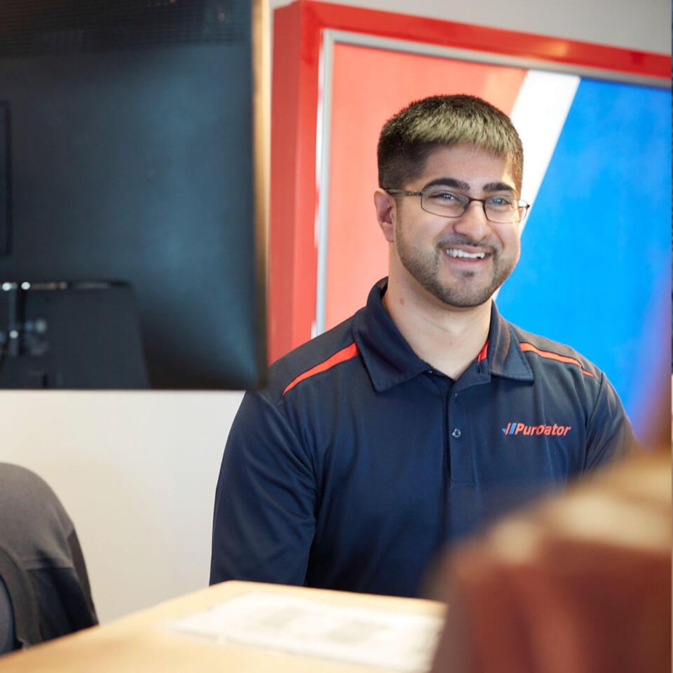 Purolator staff member helping with shipping