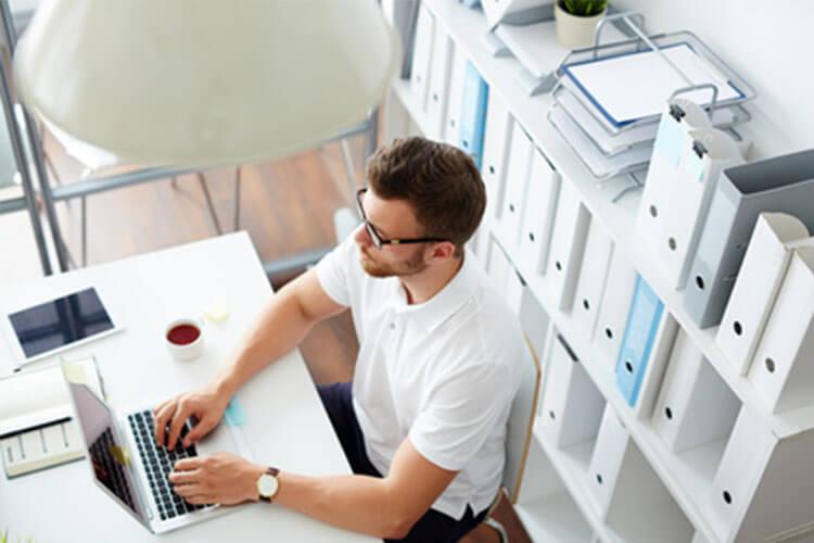 Man on laptop in office