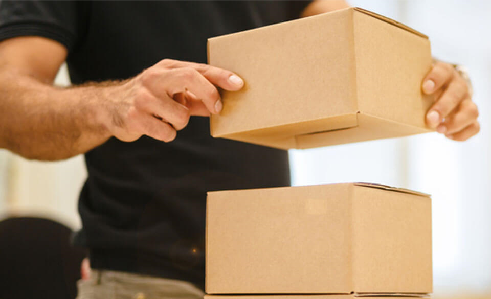 Man stacking boxes