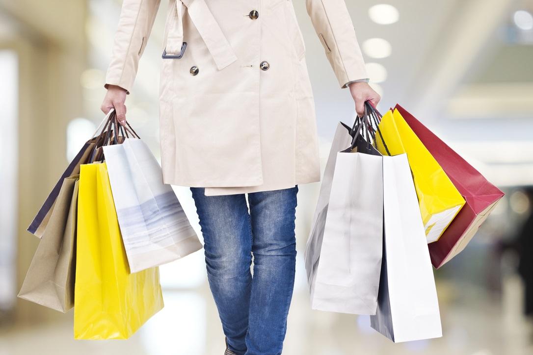 woman holding many shopping bags