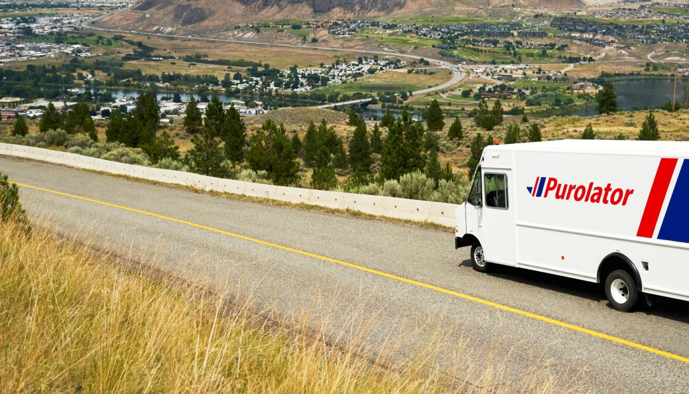 purolator truck on the road