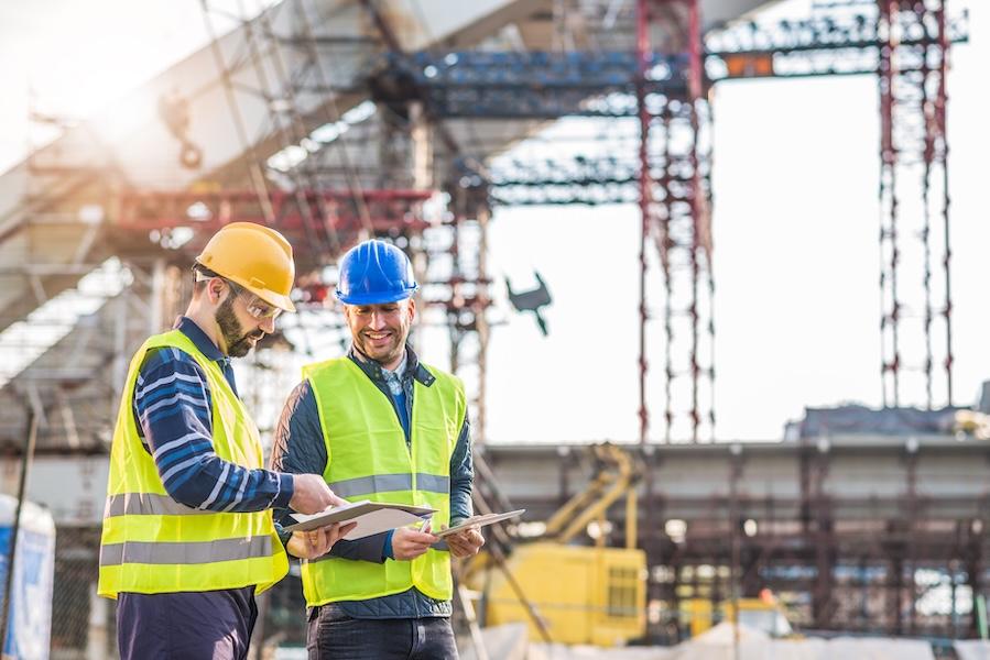 Construction workers looking at plans