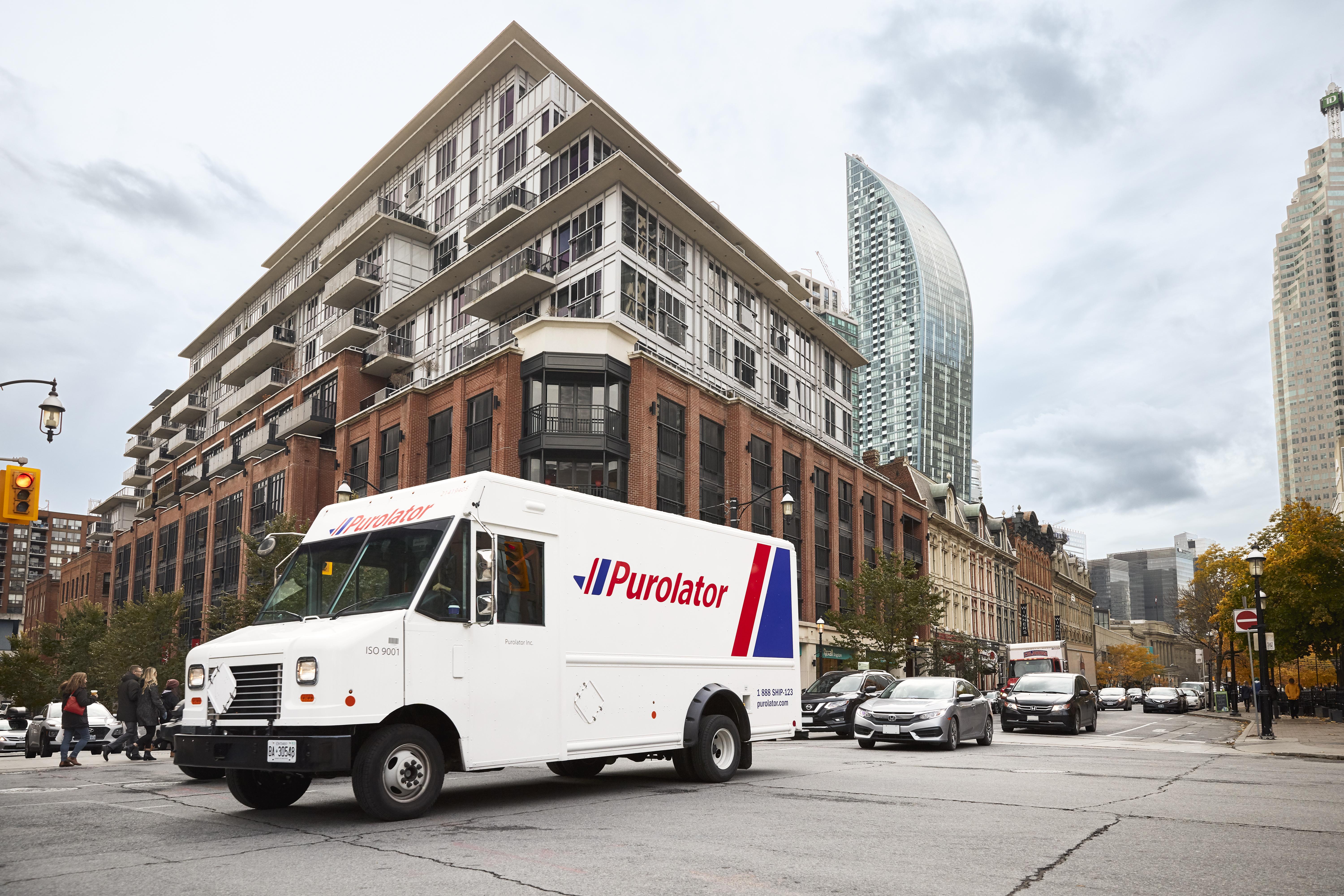 Purolator Truck in front of building corner