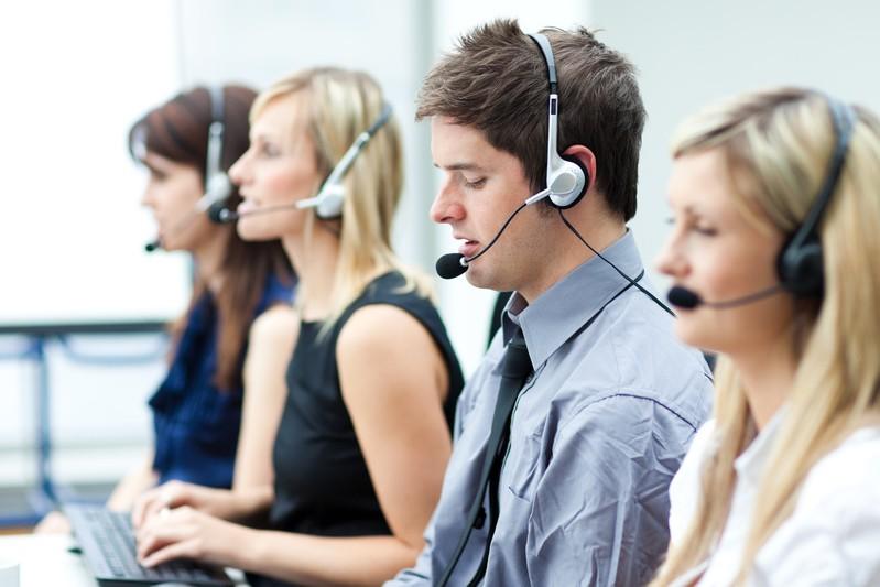 4 people listening using headphones