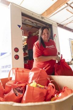 Person with bags of food supplies